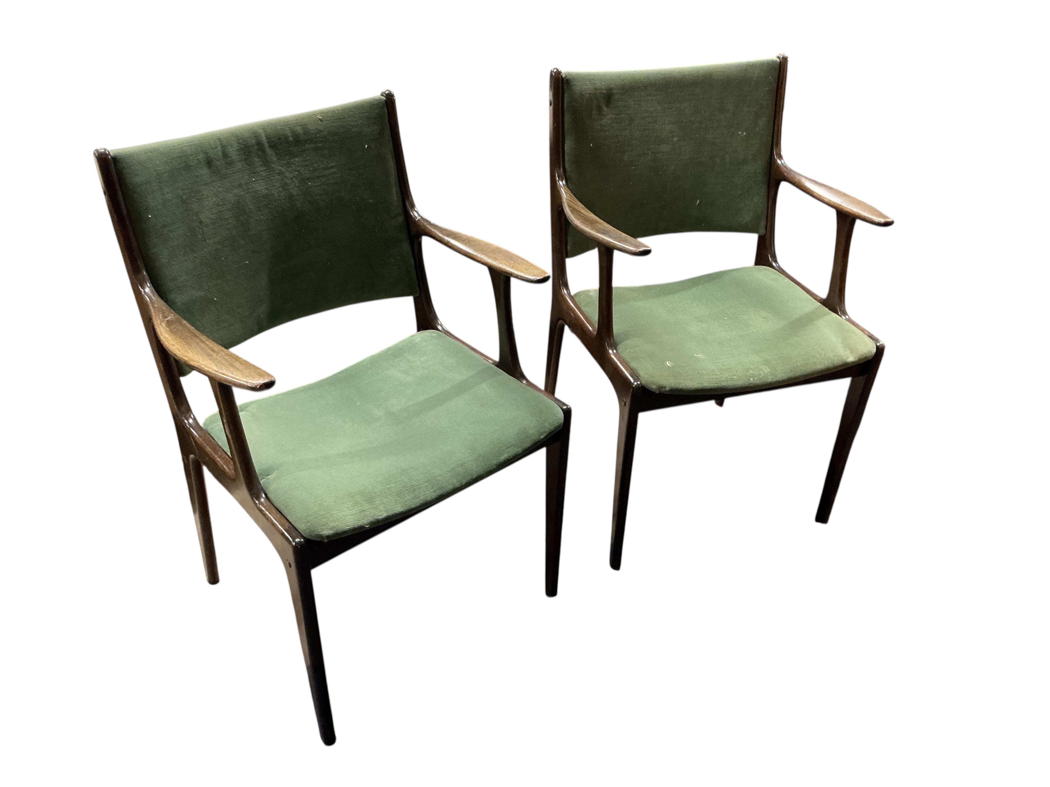 A pair of mid century teak armchairs, width 52cm, depth 45cm, height 82cm